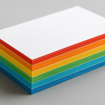 A stack of colorful sheets of paper arranged in a gradient