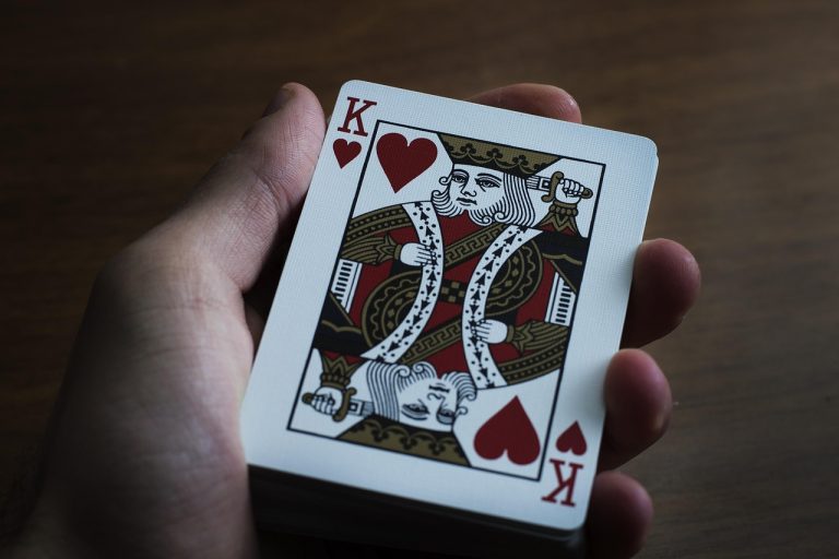 Hand, playing cards, paper — LOL Toto Site Provides Reliable Predictions for Esports Betting